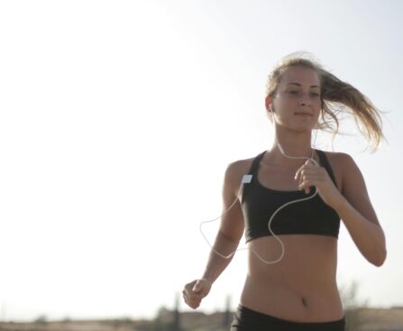 person running outdoors for heart health and cardiovascular fitness