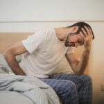person sleeping wearing smartwatch sleep tracker monitoring rest