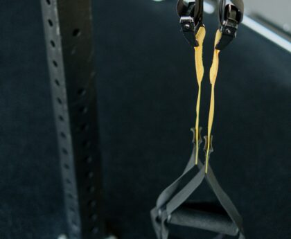 Person performing slow eccentric lowering phase of a dumbbell curl for muscle building