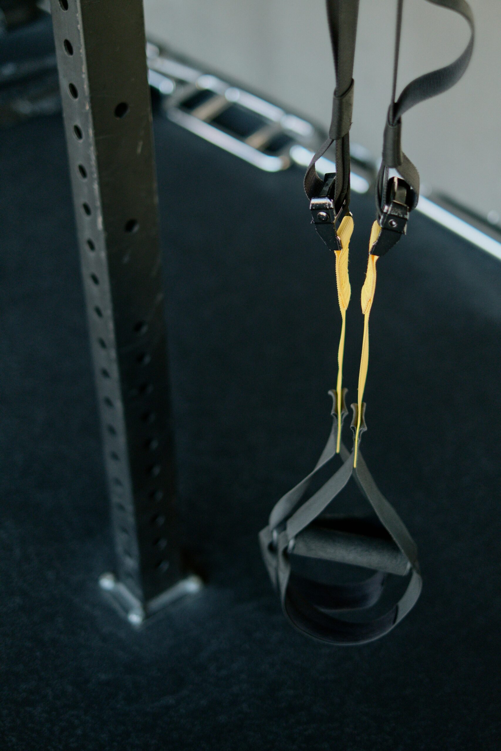 Person performing slow eccentric lowering phase of a dumbbell curl for muscle building