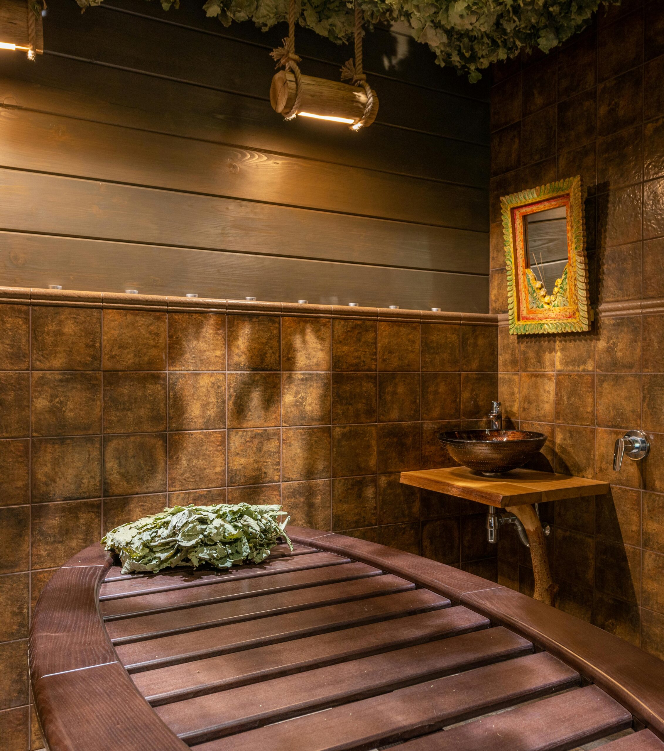 Person entering cold plunge ice bath after sauna for contrast therapy recovery