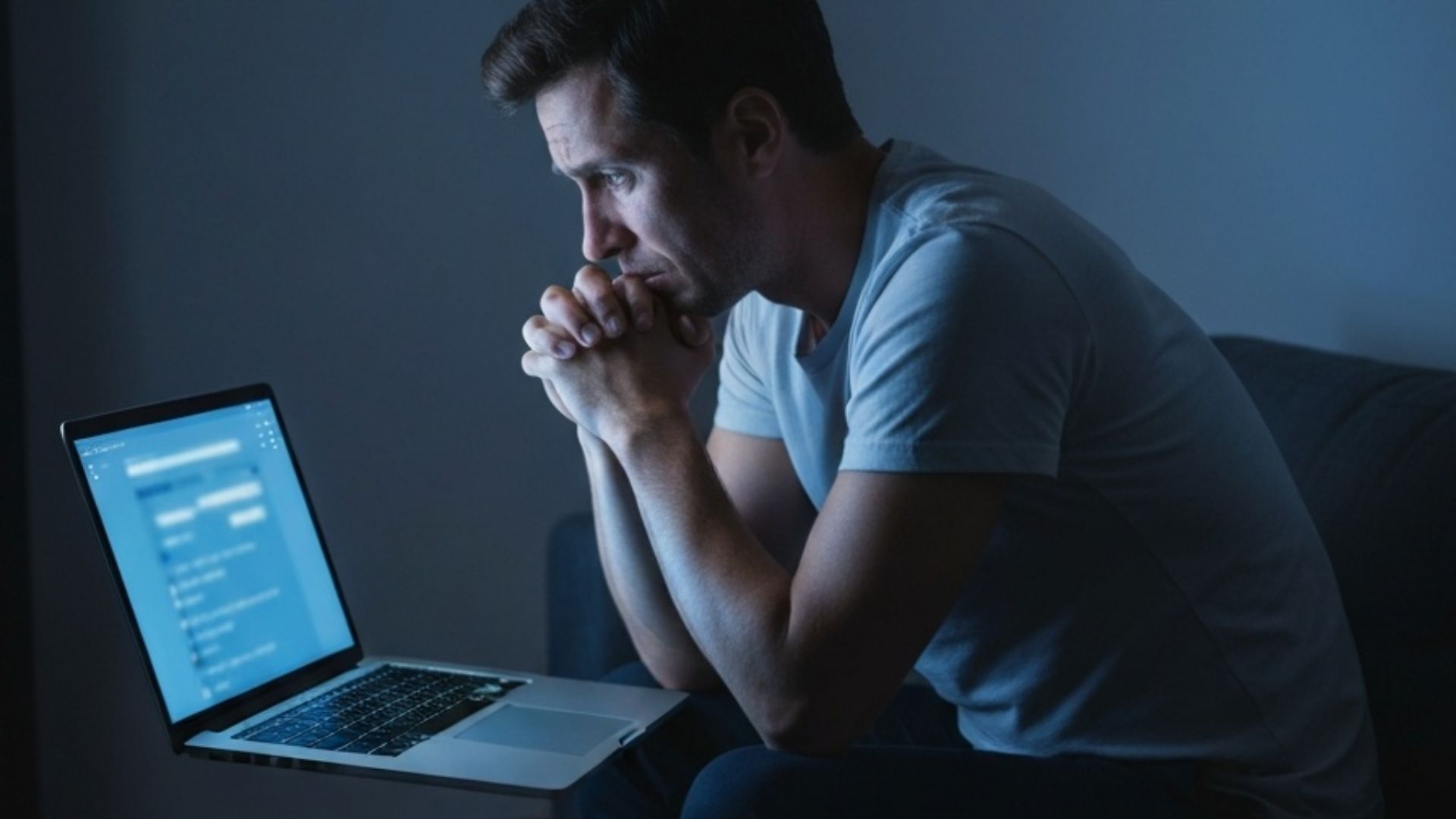 Person anxiously searching symptoms online late at night, illustrating health anxiety