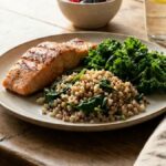 A heart-healthy plate of grilled fish, greens and whole grains