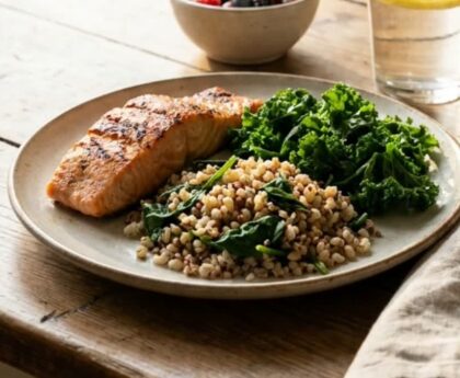A heart-healthy plate of grilled fish, greens and whole grains