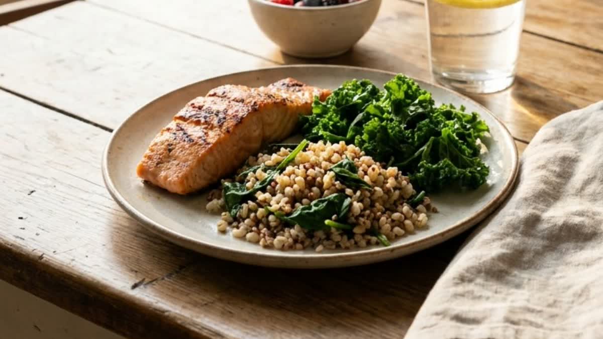 A heart-healthy plate of grilled fish, greens and whole grains