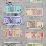 Indian rupee banknotes of various denominations laid out